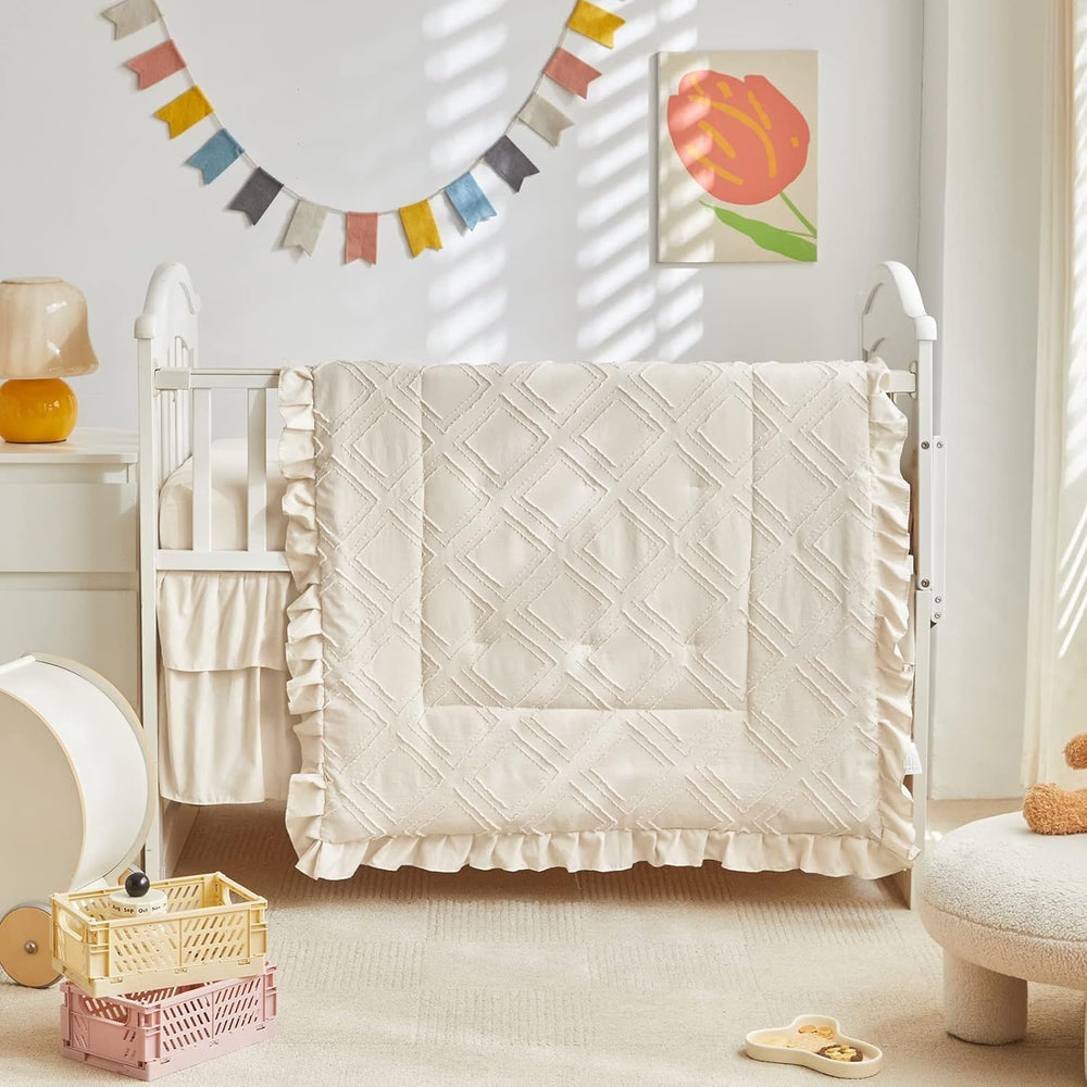 UOZZI BEDDING mini crib fitted sheet secures snugly on 28x52 inch mattress.