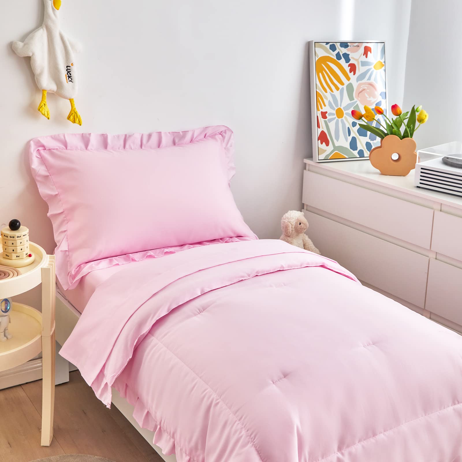 UOZZI BEDDING nursery setup with pink bed for calming bedtime routine.
