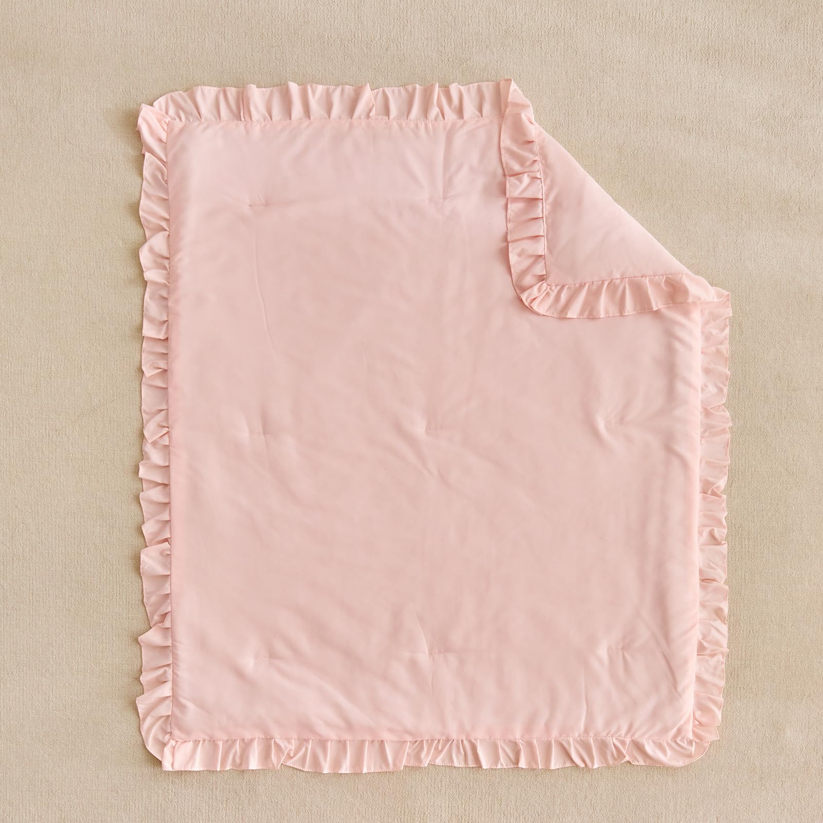 UOZZI Bedding packaging includes ruffled comforter in light pink
