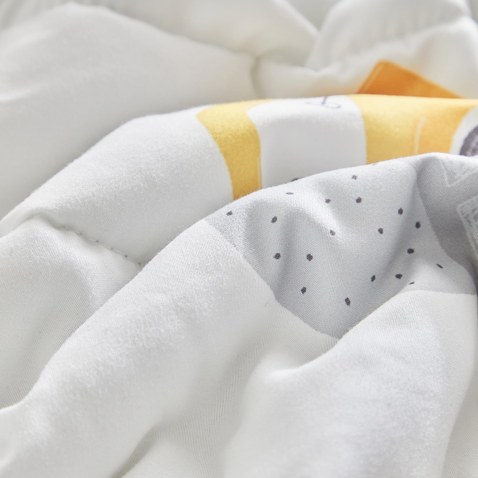 UOZZI BEDDING reversible pieces provide versatile toddler bed styling.