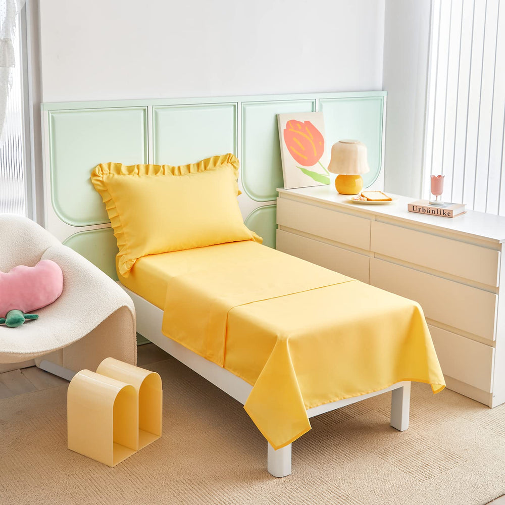 UOZZI Bedding yellow ruffle detail highlights playful fringe on comforter