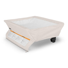 UPPAbaby Remi changing station surface attached to Remi Playard for quick diaper changes.