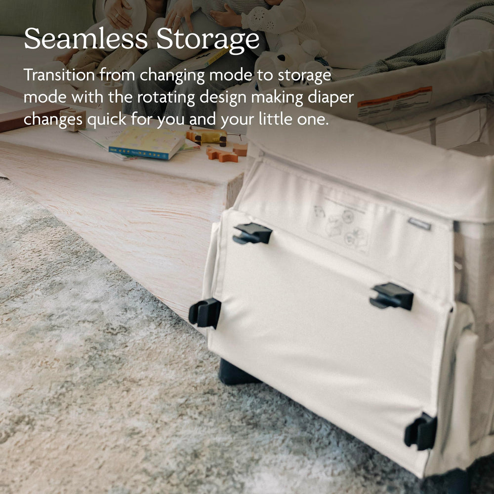 UPPAbaby Remi top rail attachment shown securing the station to the Playard.