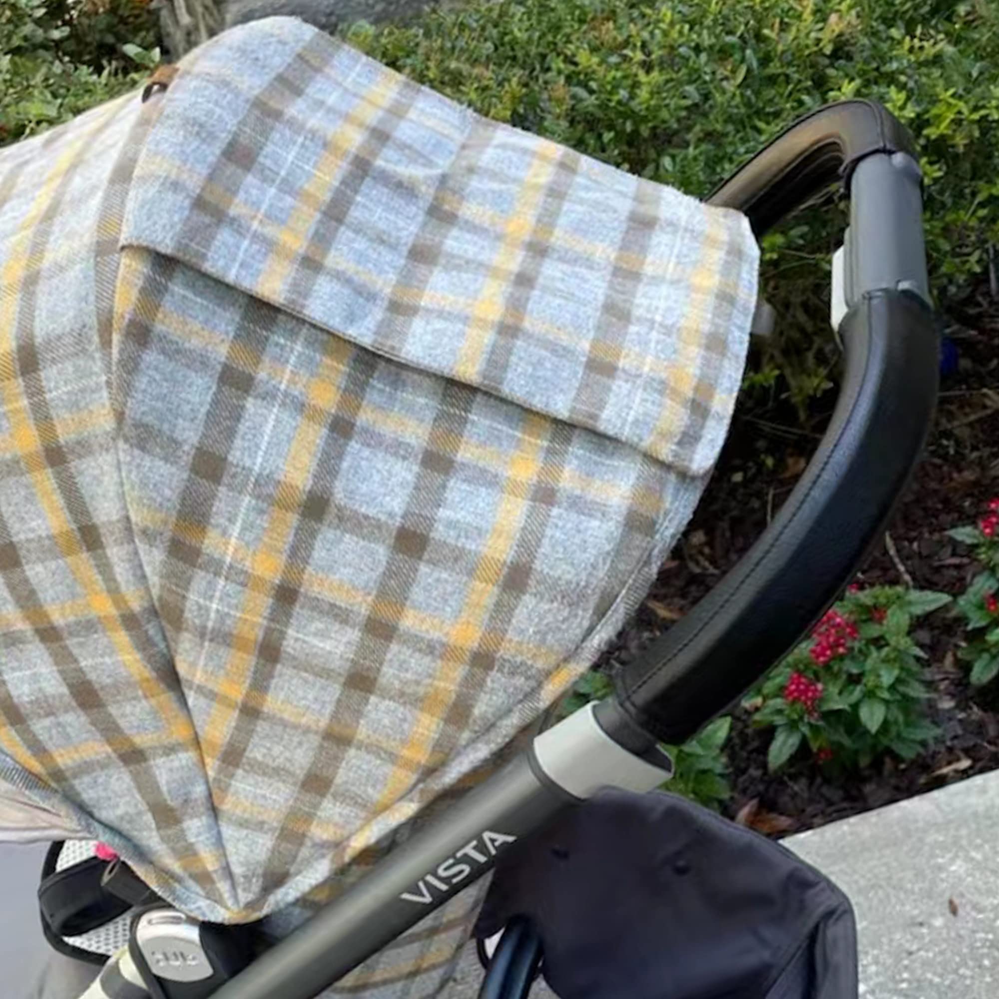 Uppababy Vista handlebar cover brown closeup showcases elegant texture and dirt protection.