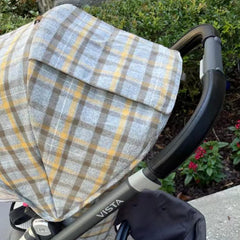 Uppababy Vista handlebar cover brown closeup showcases elegant texture and dirt protection.