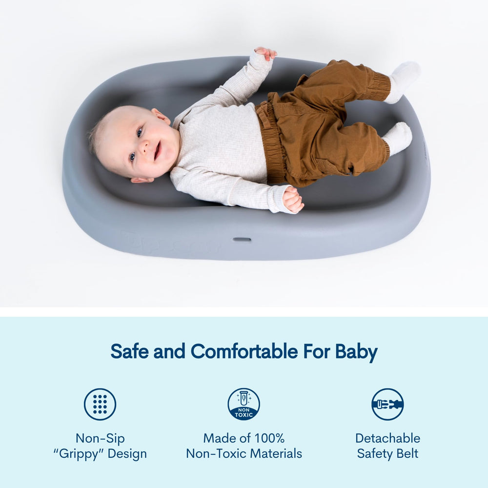 Upseat changing pad with liquid-resistant surface cleans easily and resists stains.