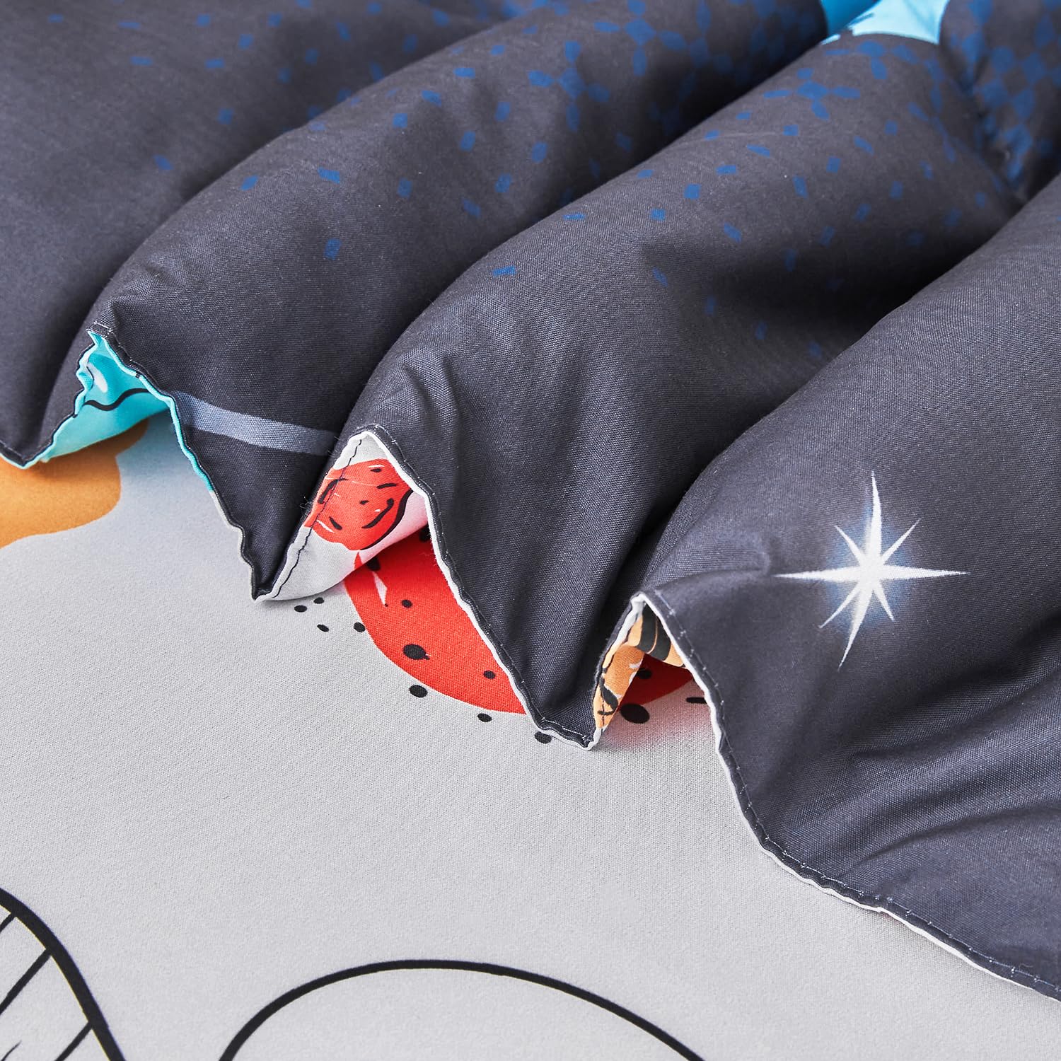 URBONUR bedroom scene with space dinosaur bedding creates a playful bedtime vibe