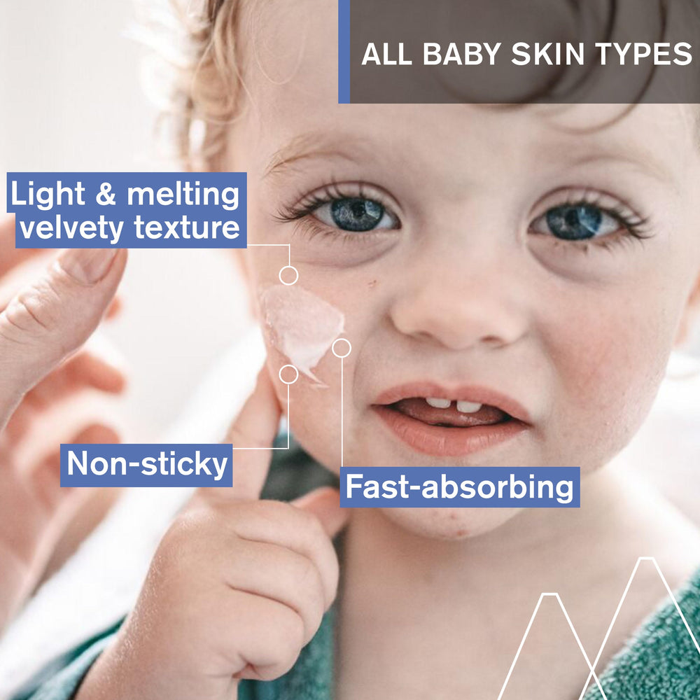 Uriage Baby 1st Moisturizing Cream texture closeup showing light, non-greasy feel for newborn skin.