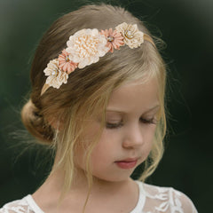 Utaly back-pad floral crown secured without slipping on tiny heads.