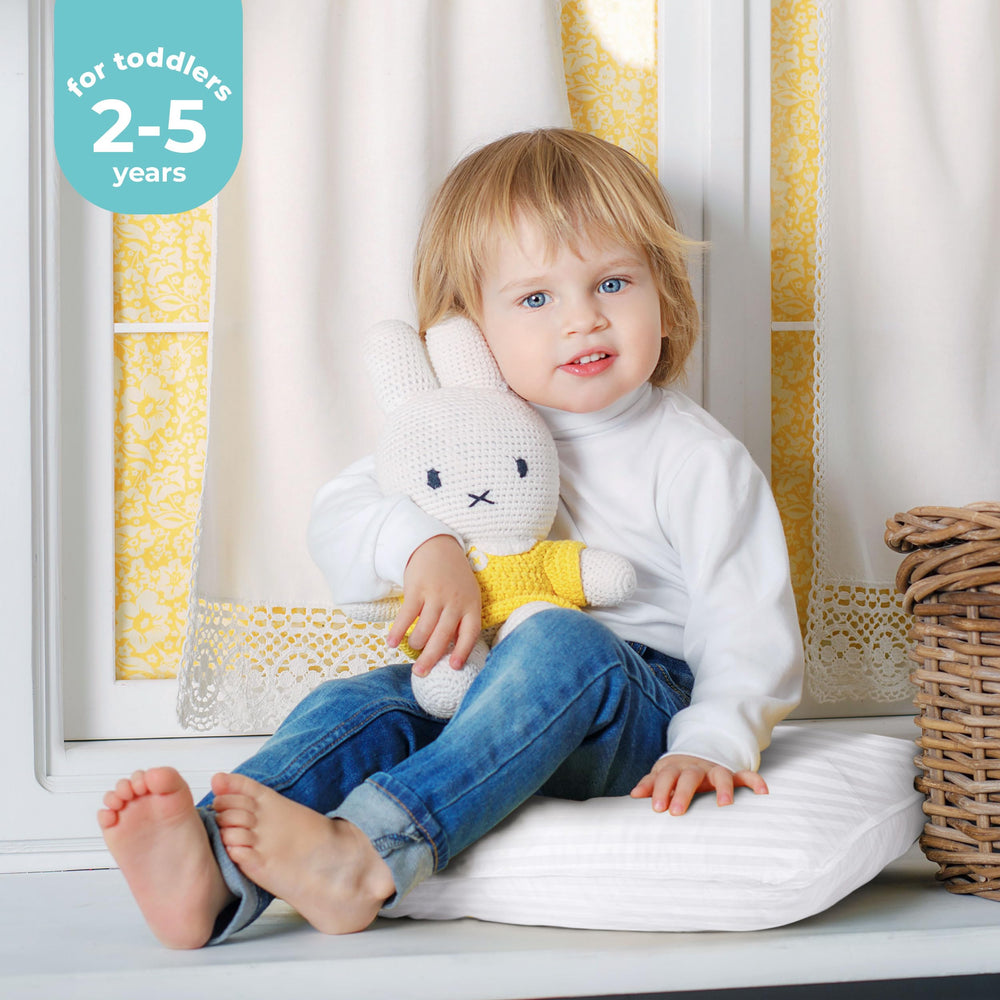 Utopia Bedding toddler pillow on kid's bed demonstrates compact size for small spaces.