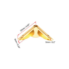 uxcell corner protectors in gold tone shown on a notebook highlight sleek protection and style