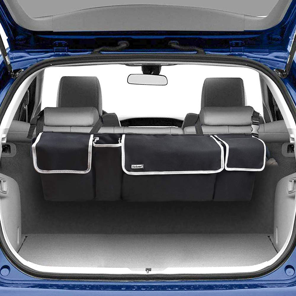 Vakeen backseat trunk organizer hanging with four pockets for organized road trips.