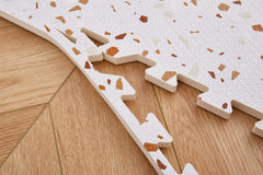 Valioza Terrazzo Playmat brown assembled 180x120 cm laid out in a room