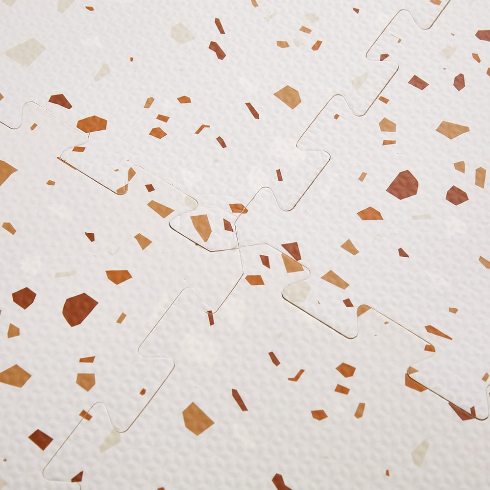 Valioza Terrazzo Playmat brown zipper storage bag beside tiles