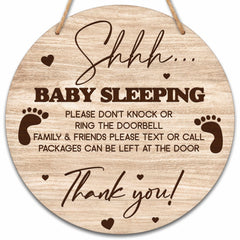Valucise baby sleeping sign on front door, round wood with rope for quiet entry reminders.