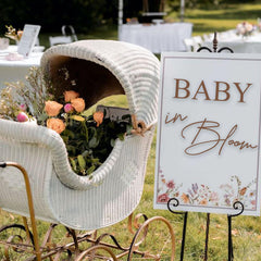 VANGNING Baby in Bloom decal sign on a wall with rustic brown lettering