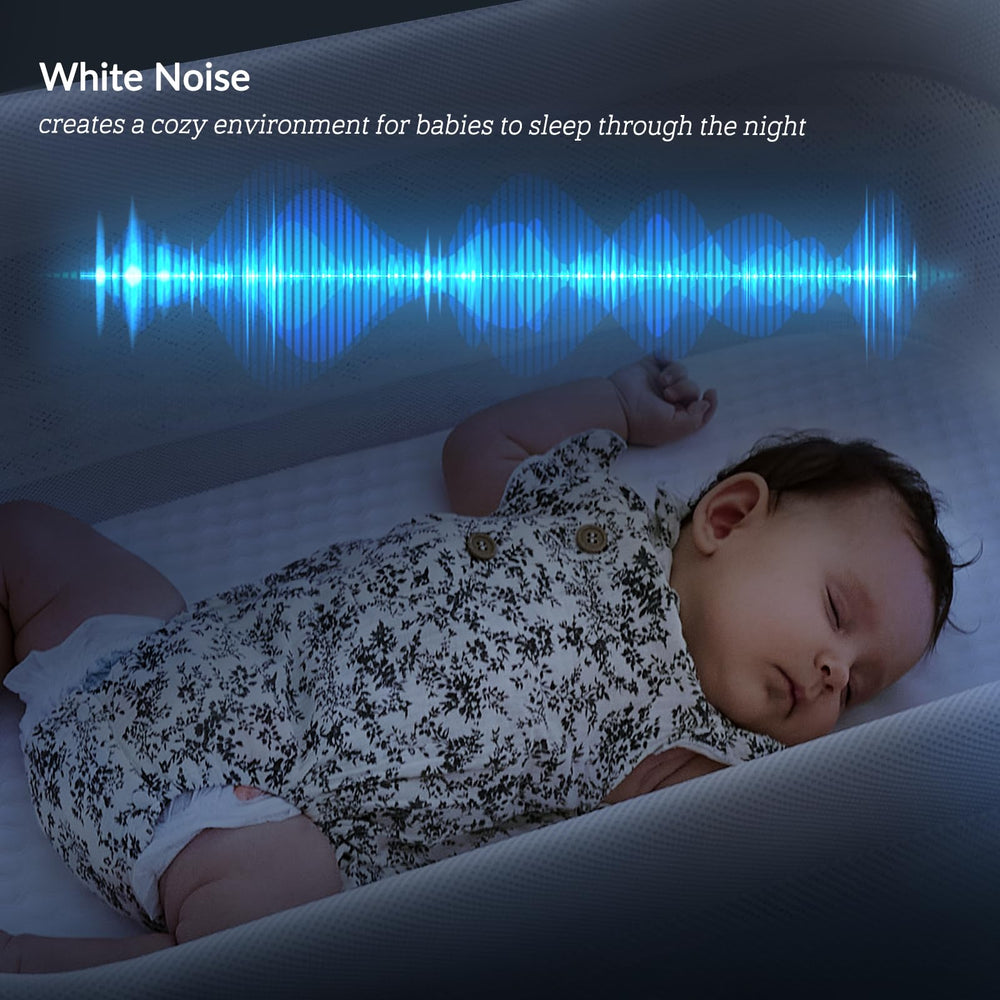 VaVaSoo gray bassinet beside the bed for easy nighttime handling.