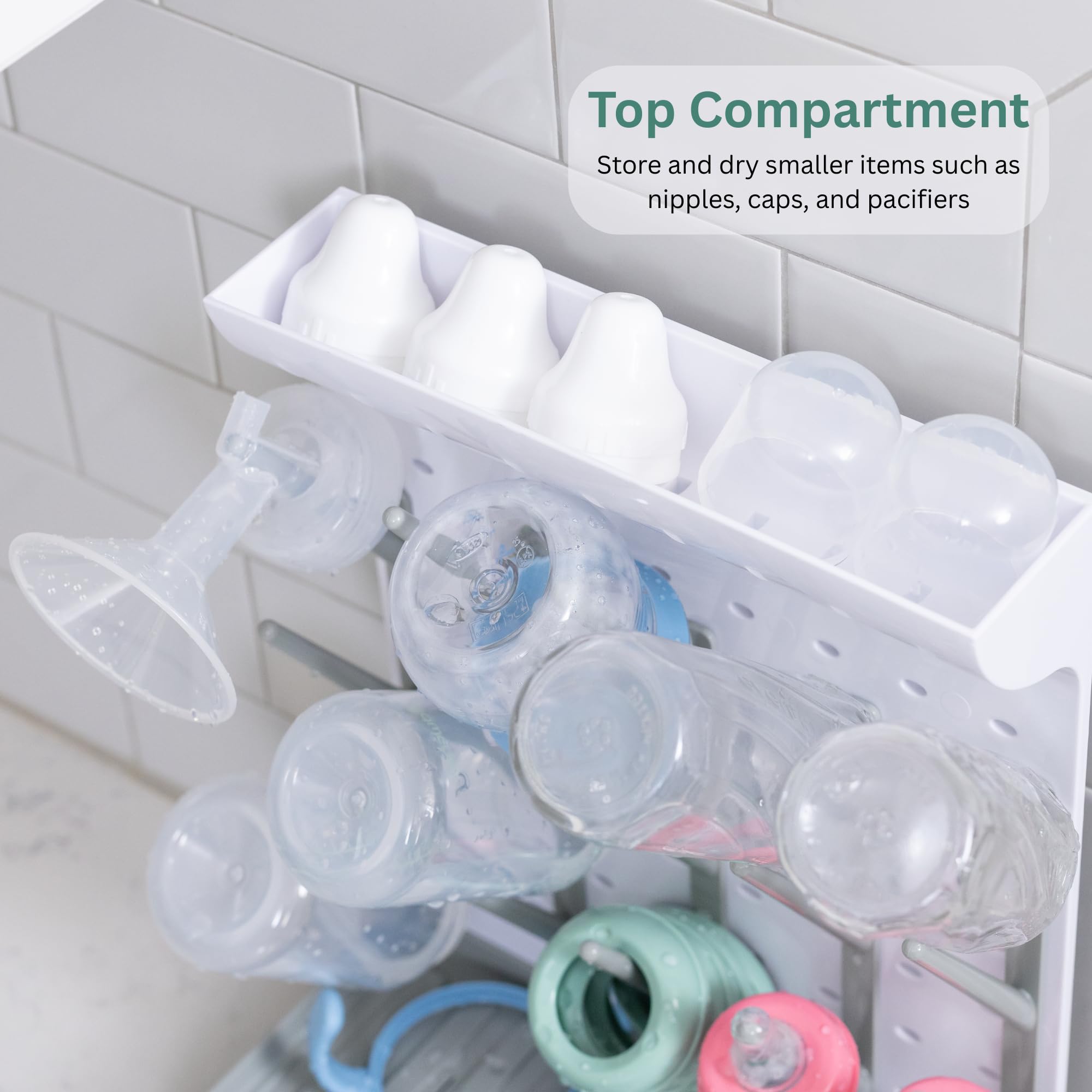 Velakade Baby Bottle Drying Rack full capacity image emphasizes 15 bottles organized with nipples and pacifiers
