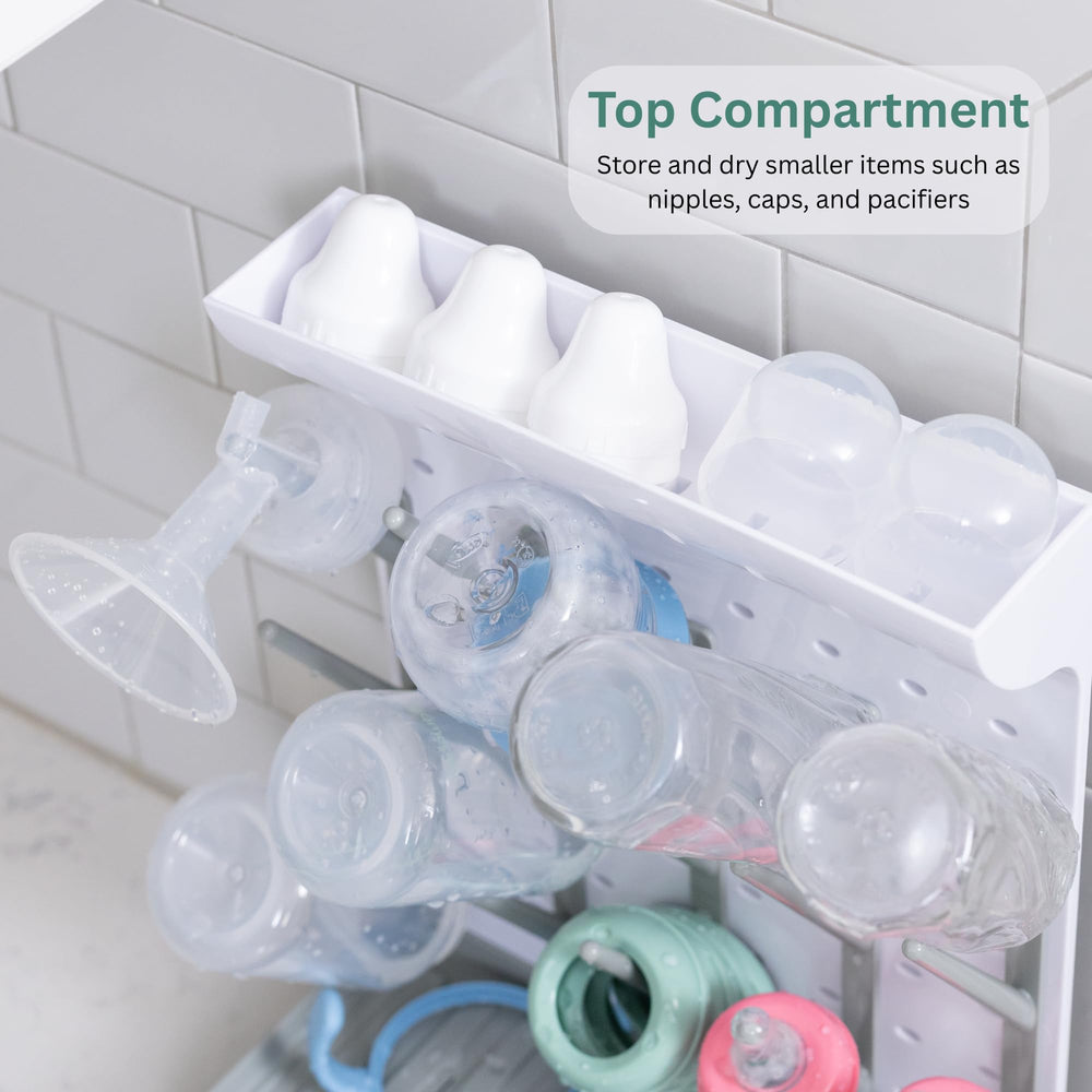 Velakade Baby Bottle Drying Rack full capacity image emphasizes 15 bottles organized with nipples and pacifiers