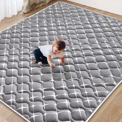 Vibe Bear baby play mat close-up shows thick foam for soft cushioning during tummy time.