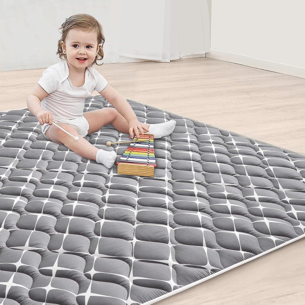 Vibe Bear play mat shown in living room setup offering spacious cushioning for babies.