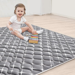Vibe Bear play mat shown in living room setup offering spacious cushioning for babies.