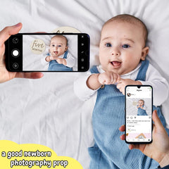 Vichona milestone cards paired with baby clothes for storytelling