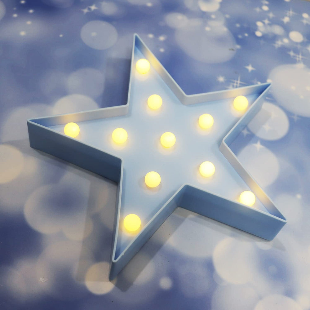 Vicila LED marquee star night light brightens kids' room with soft blue ambiance.