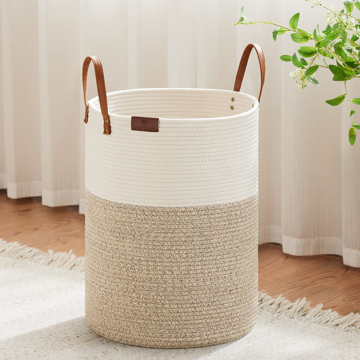 VIPOSCO tall laundry basket with blanket storage keeps living room tidy.