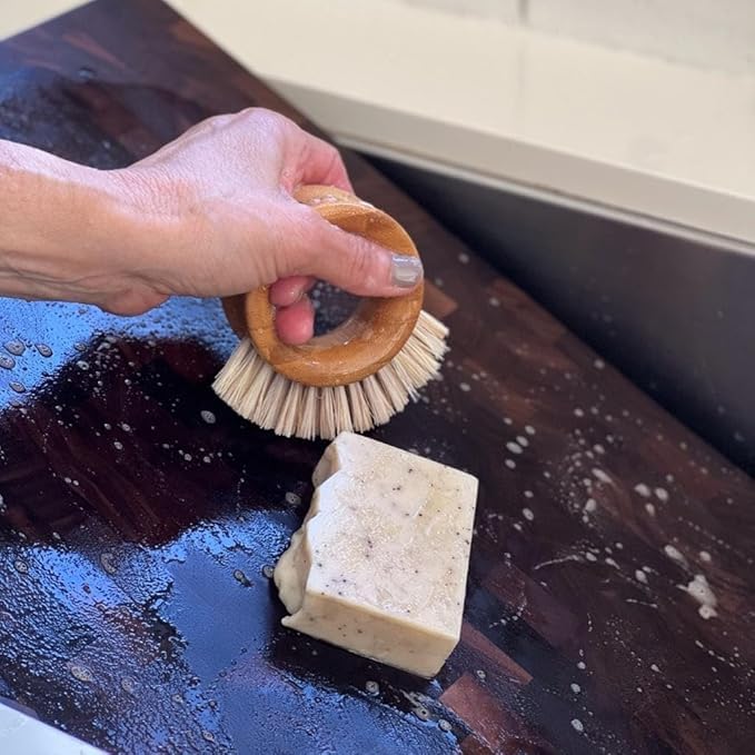Virginia Boys Kitchens cutting board soap packaging closeup emphasizing small batch, cold-pressed craft.