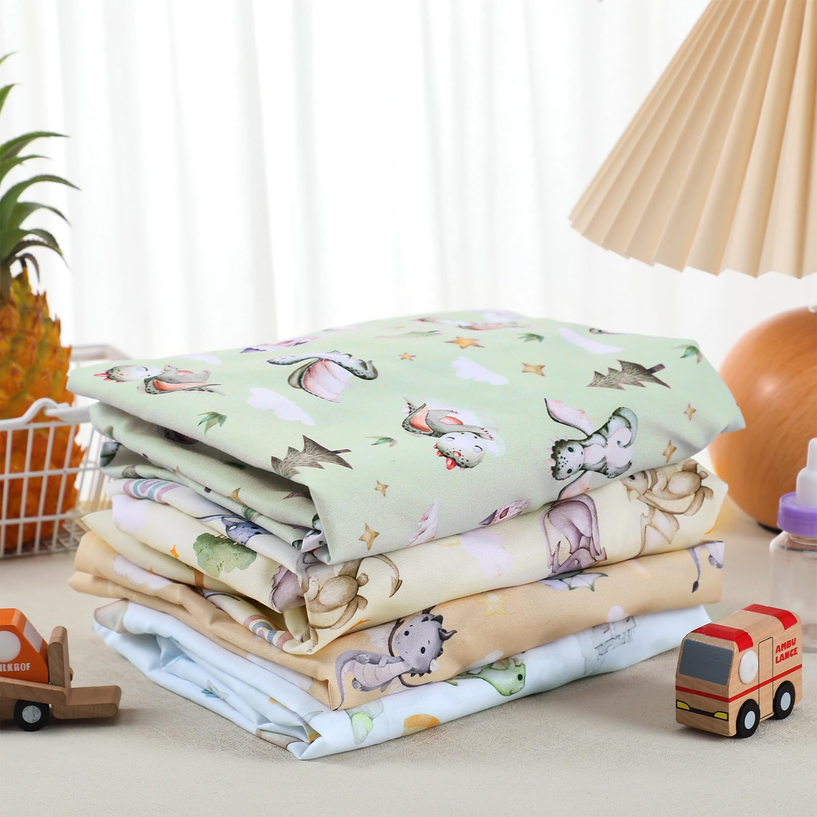 VitalCozy dragon bassinet sheet packaging showing color variations for genders