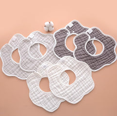 VIVANA Muslin Cotton Baby Bibs flat lay, showcasing soft fabric and colorful prints for drool and feeding.
