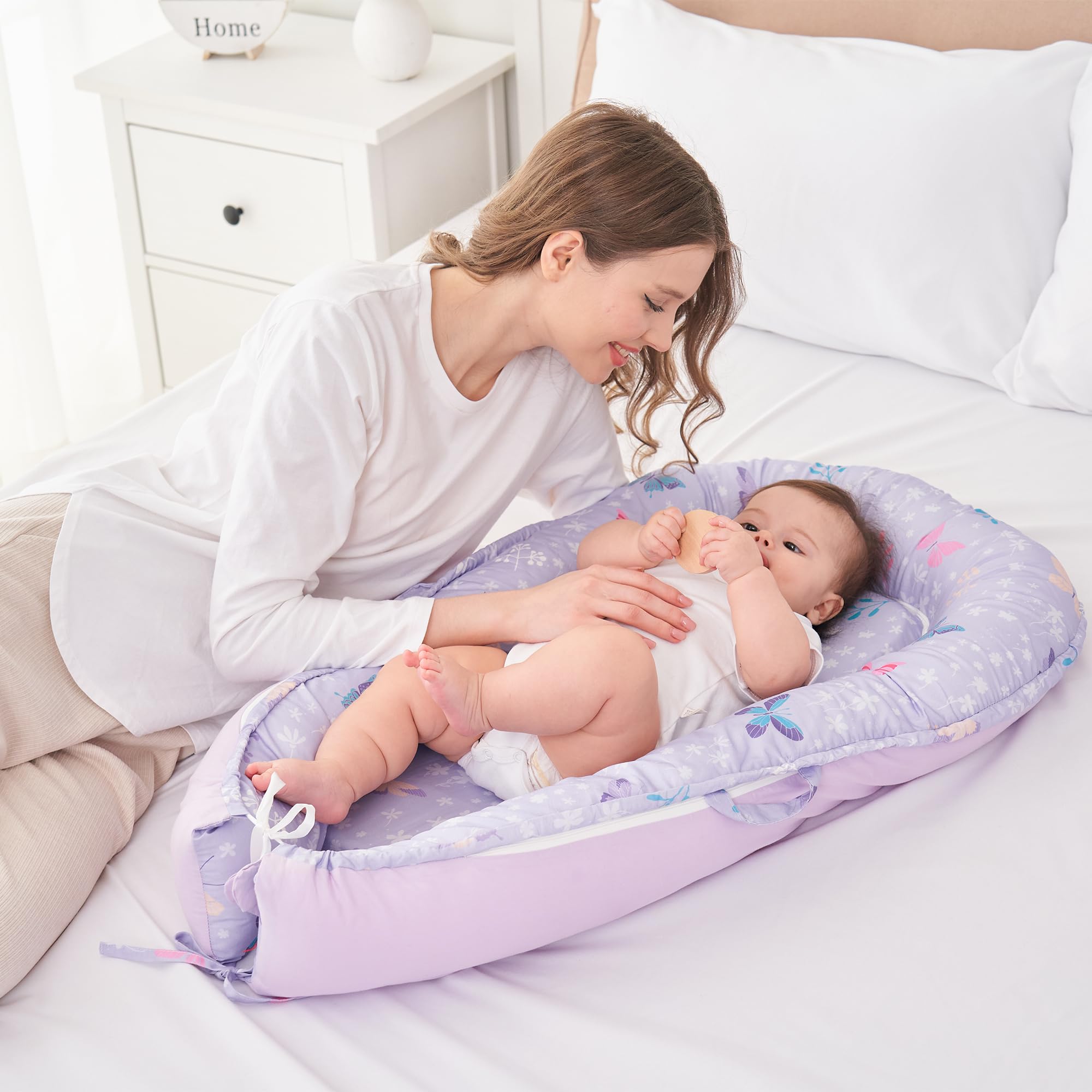 Viviland Baby Lounger Butterfly bumper detail highlighting soft, supportive edges.