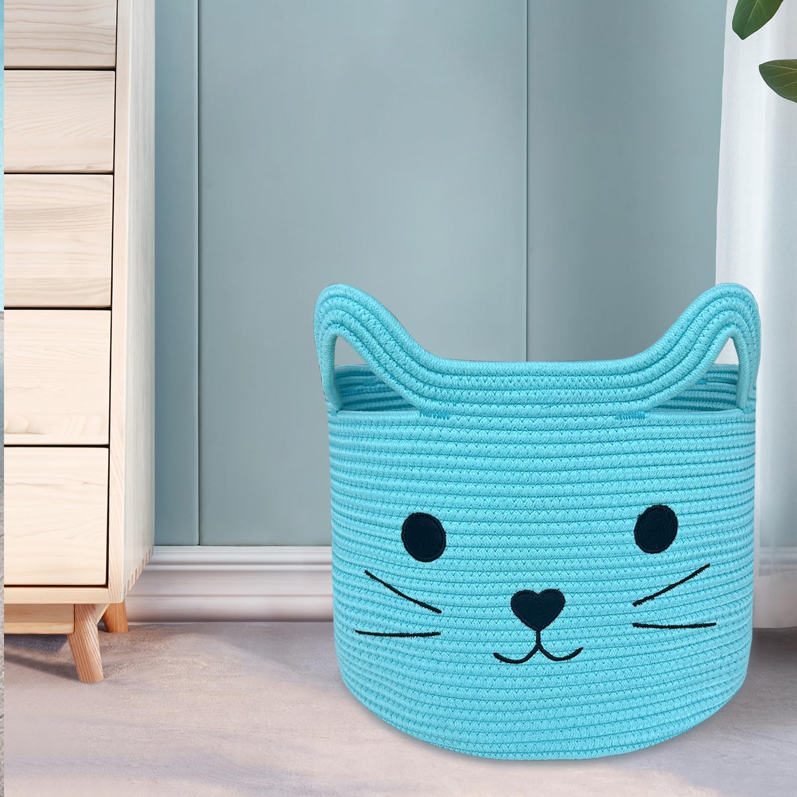 VK VK·LIVING cat basket used for laundry and towels in bathroom or laundry room.