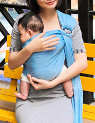 Vlokup Baby Water Ring Sling with baby in sling demonstrating chest kiss comfort in water.