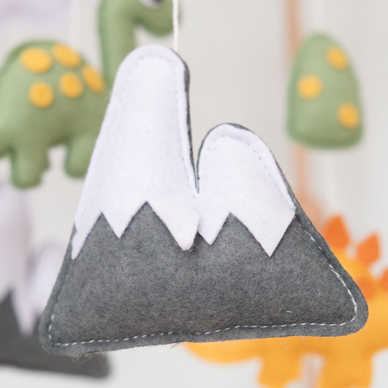 Vlokup dinosaur mobile enhances nursery decor with playful gender-neutral charm