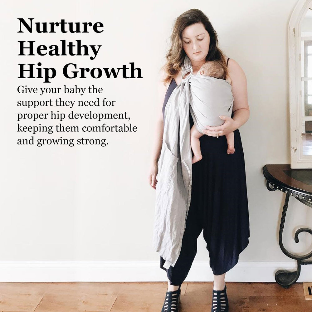Vlokup ring sling carrier worn by parent demonstrating ergonomic support.