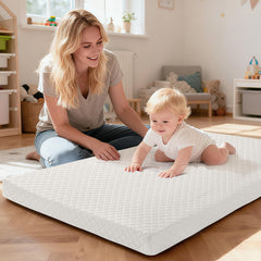 voomf pack n play mattress pad dual-sided foam close-up highlights versatile support for babies.