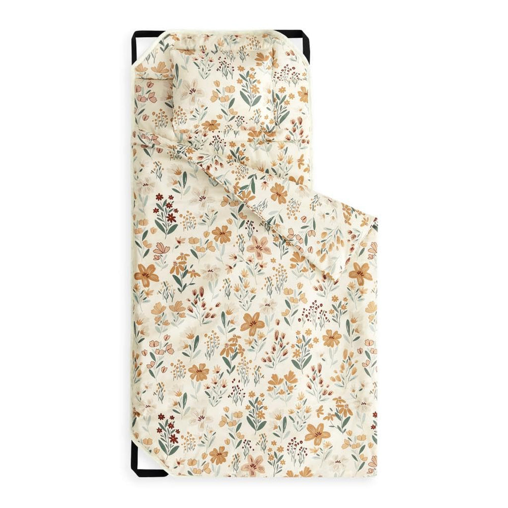 Wake In Cloud cot nap mat floral orange cream closeup highlights vibrant pattern for cozy preschool naps.