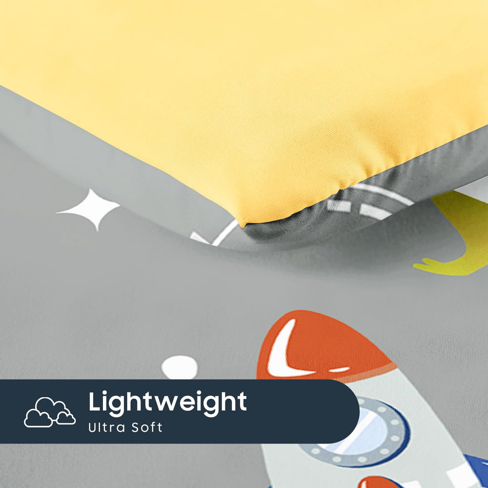 Wake In Cloud dinosaur-astronaut bed setup showing complete 4-piece set on a toddler bed