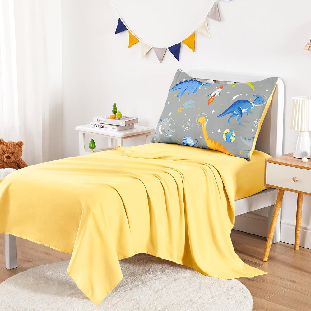 Wake In Cloud dinosaur-astronaut pillowcase complements the set with smooth microfiber texture