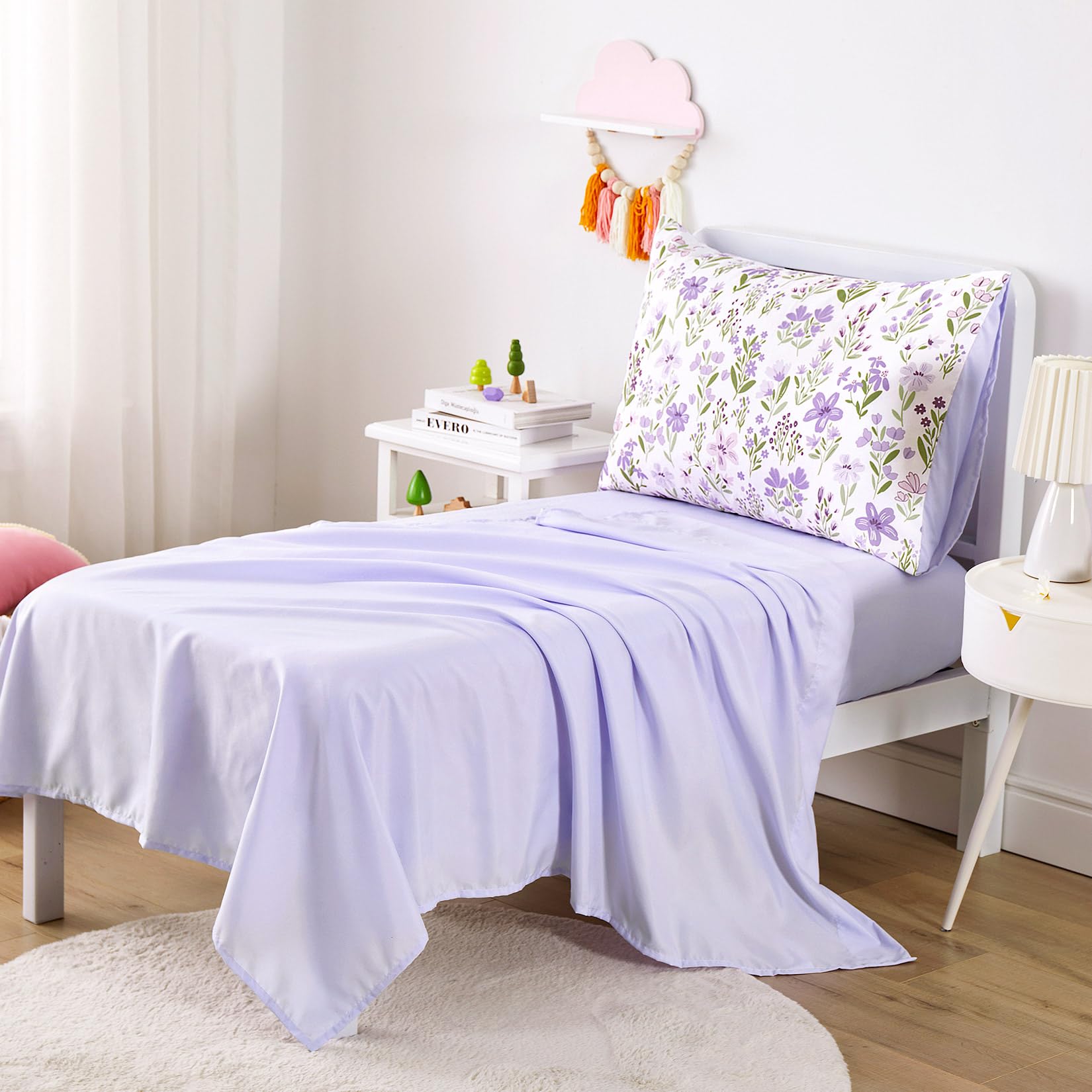 Wake In Cloud fitted sheet with all-around elastic and 8-inch pocket fits standard toddler mattresses.