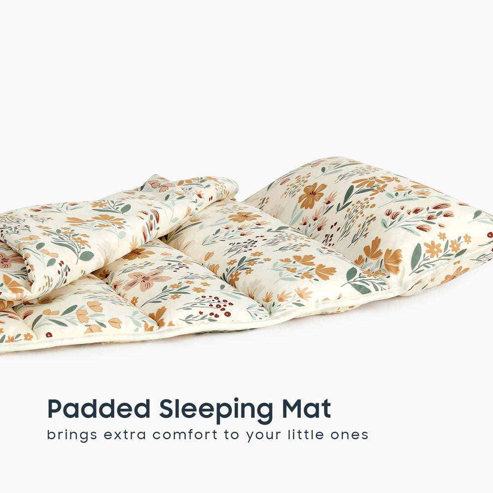 Wake In Cloud nap mat with removable pillow for adjustable comfort.