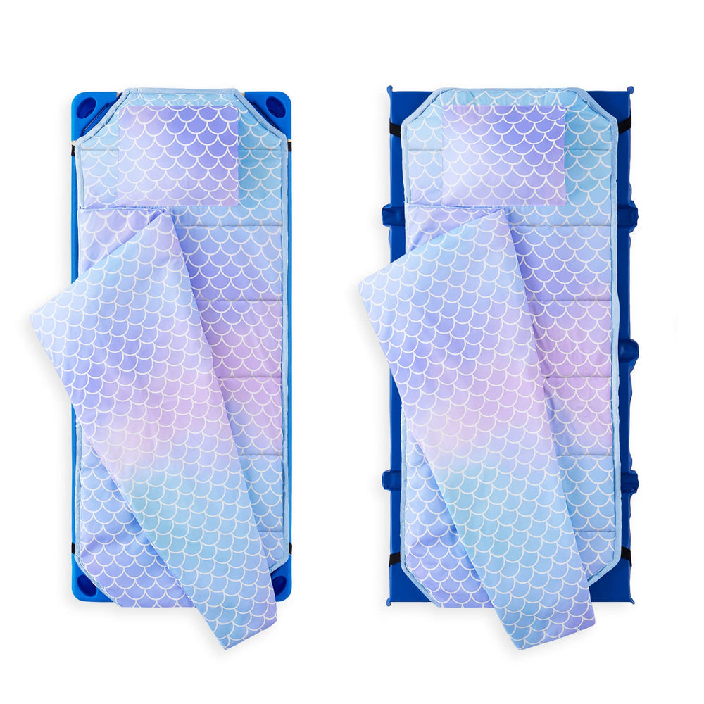Wake In Cloud nap mat rolled with hook and loop strap for portable daycare travel.