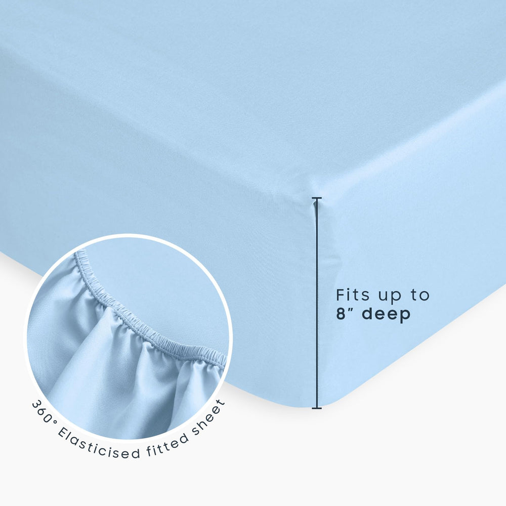 Wake In Cloud royal-blue dino-space bedset on bed illustrating kid-friendly, imaginative sleep space