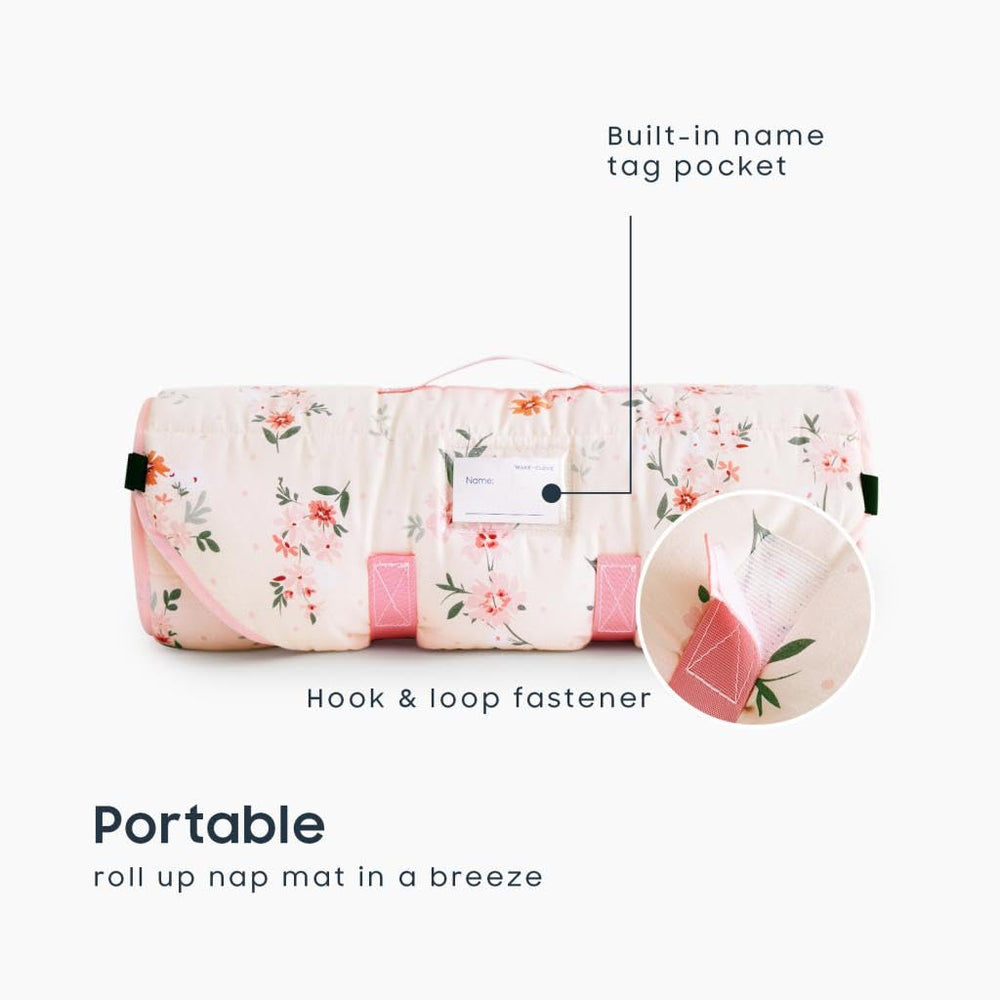 Wake In Cloud nap mat pillow attached for compact, cozy nap time.