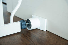 Wall Nanny Extender stabilizes a pressure-mounted gate for steady doorway use.