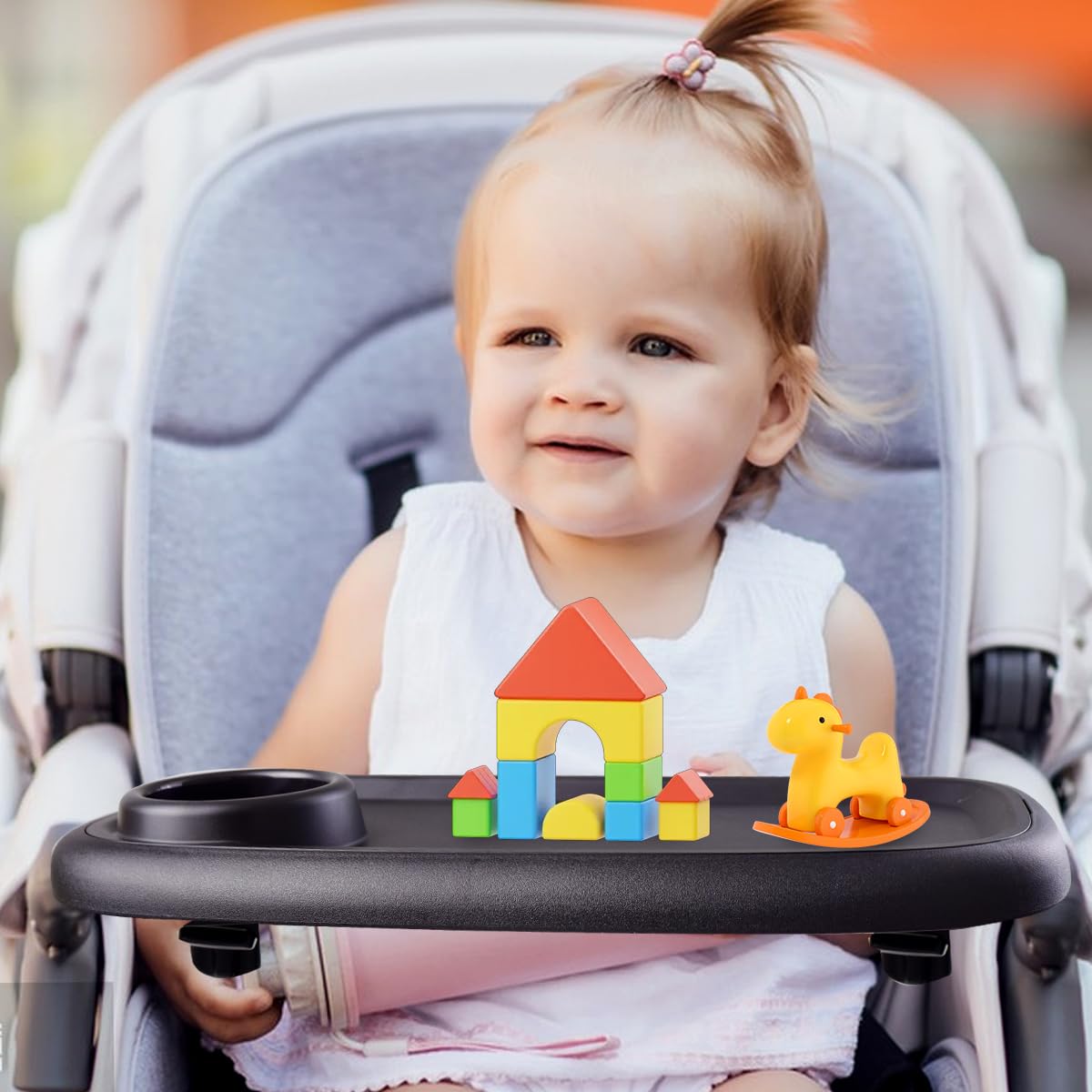 Wanateber snack tray in use on a stroller shows non-slip surface and easy access.