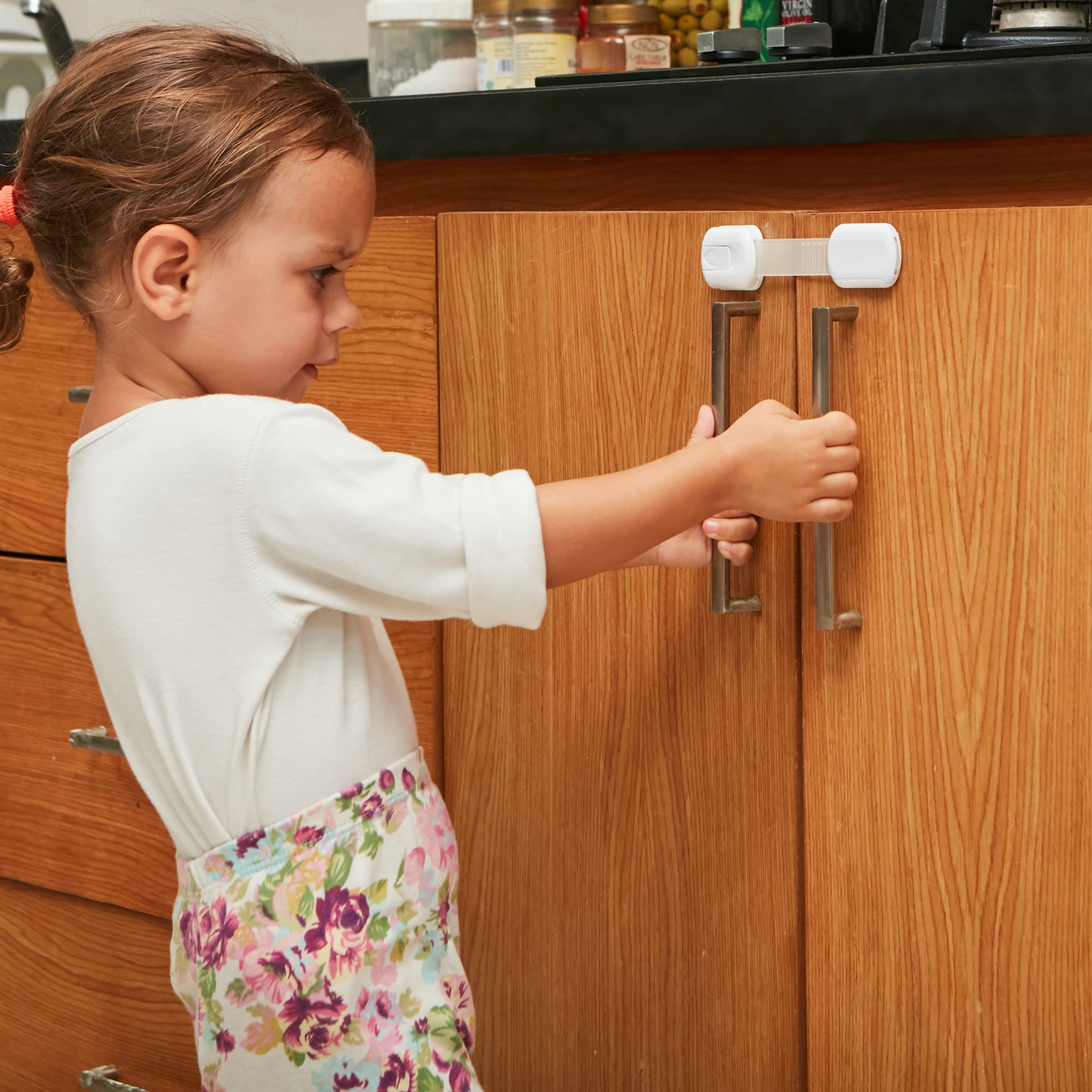 Wappa child safety straps applied to a cabinet door for safe child access