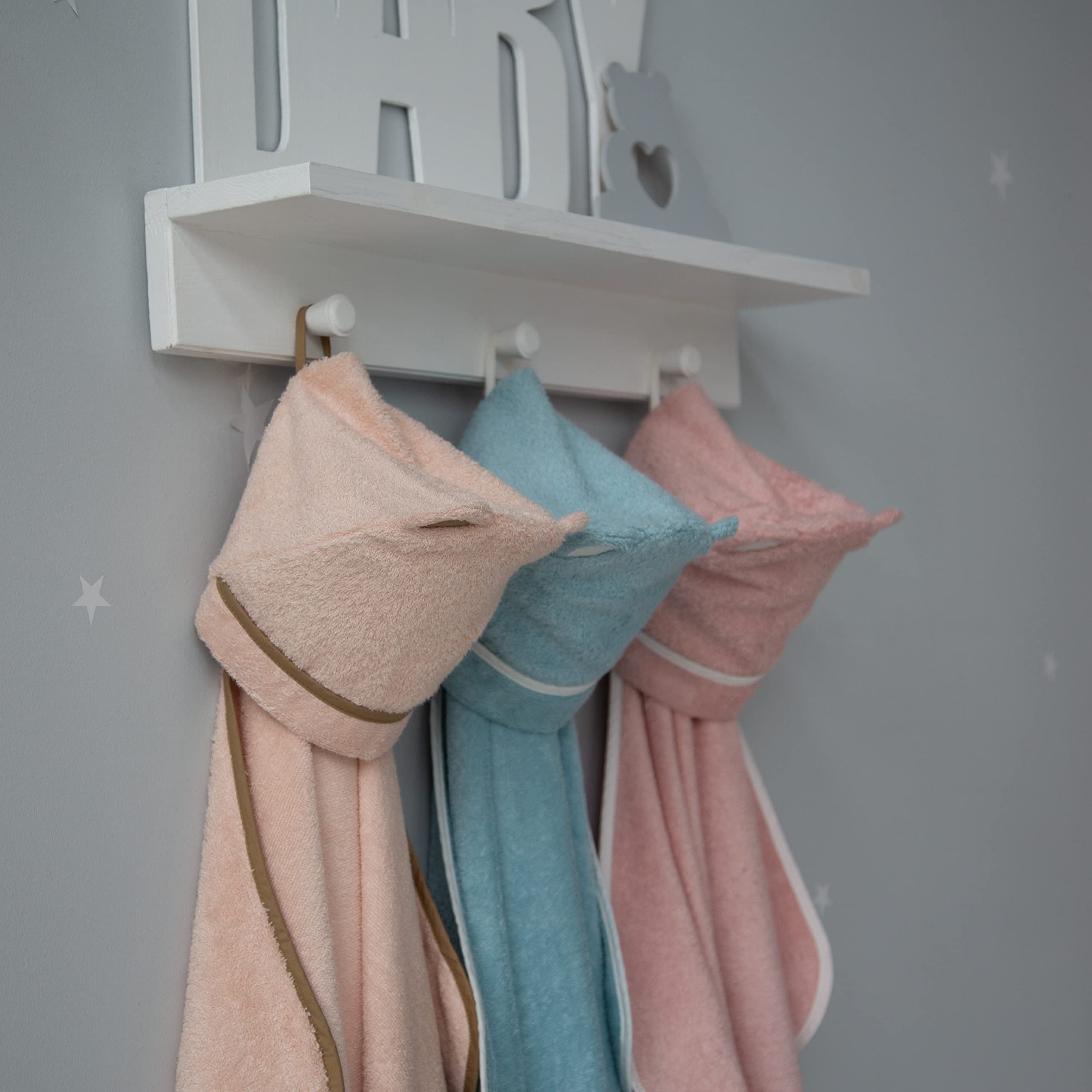 Warm Cuddles toddler towel-hood blue on child after bath emphasizes gentle warmth and absorbency.